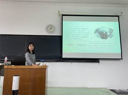 A person standing in front of a screen  Description automatically generated with medium confidence